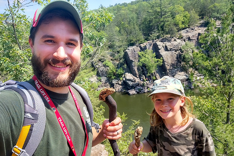 Jake Wattenphul right age to mentor boys_trail life troop hike by river cliff