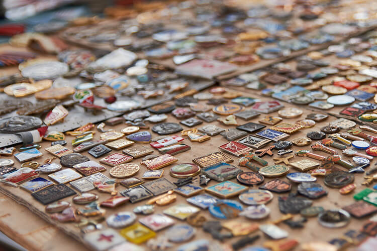 Large display of pins and awards for leader and scout accomplishments on a table
